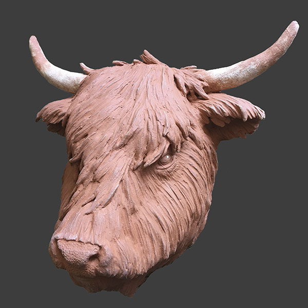 Figurative ceramic sculpture of a Highland Cow