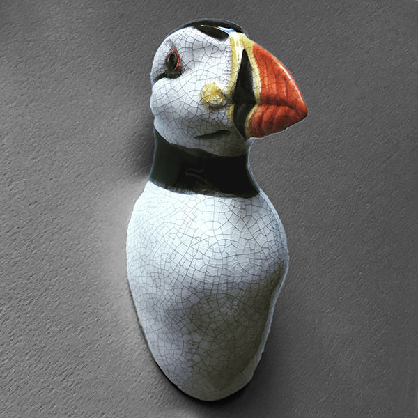 Figurative ceramic sculpture of a Puffin