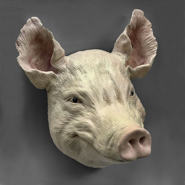 Figurative ceramic sculpture of a Pig head